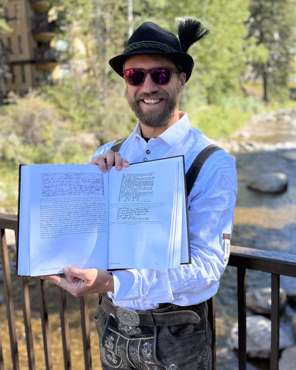 Daniel Dobesh holding his finished family history book